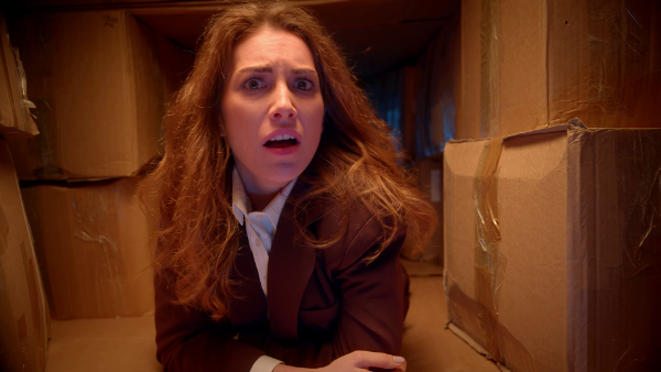 Looking worried in a cramped warehouse